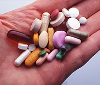 hand full of supplement pills